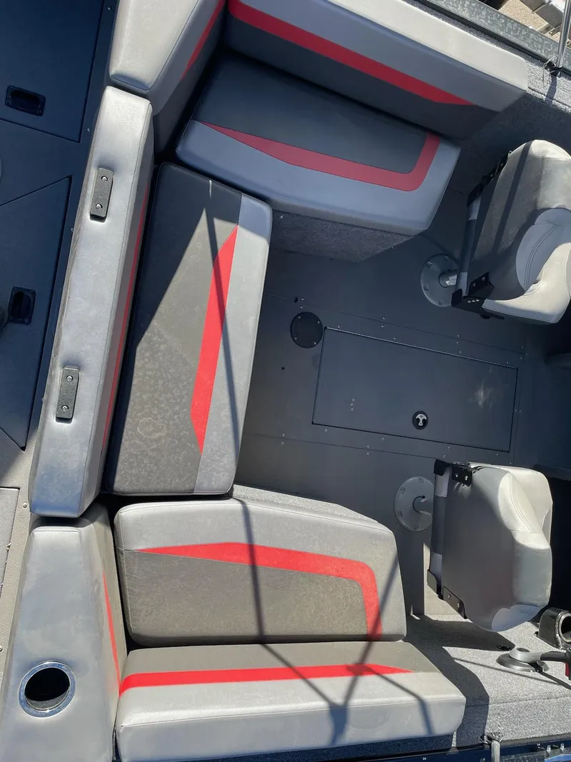Slide: The Image of 2024 Princecraft Sport 175 MAX boat interior with gray and red seating. - 15