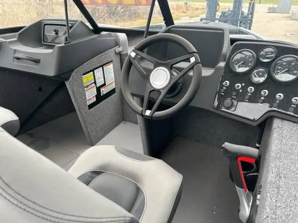 Slide: The Image of 2024 Princecraft Sport 175 MAX boat interior with steering wheel and dashboard controls. - 4