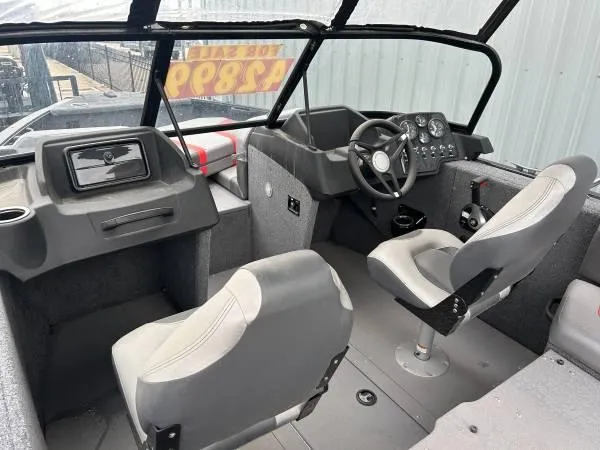 Slide: The Image of 2024 Princecraft Sport 175 MAX boat interior with steering console and seating. - 6