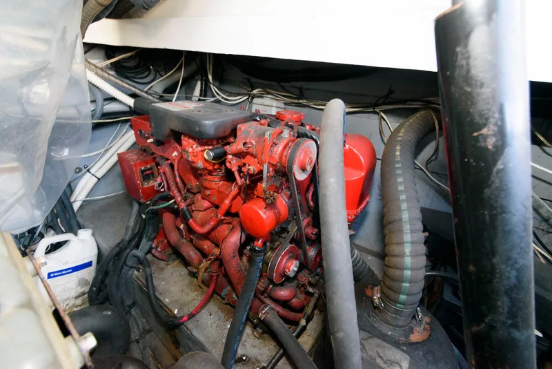 Slide: The Image of Engine room of 2001 Sea Ray 340 Amberjack with red engine components. - 21