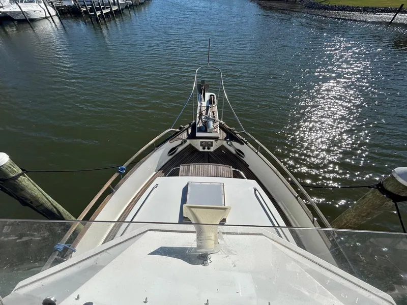 Slide: The Image of Grand Banks 42 Classic 1986 yacht bow view at marina, sunny day. - 17