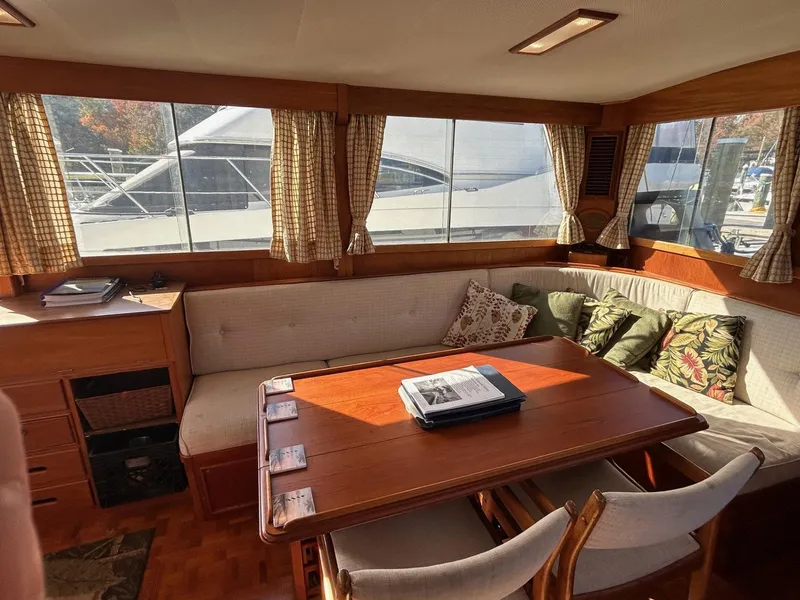 Slide: The Image of Interior of 1986 Grand Banks 42 Classic yacht with cozy seating and wooden table. - 27