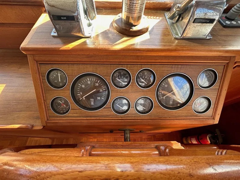 Slide: The Image of Dashboard of a 1986 Grand Banks 42 Classic boat with gauges and controls. - 31