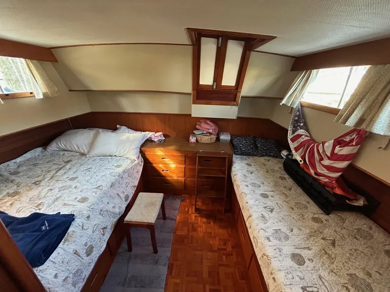 Slide: The Image of Cozy cabin interior of 1986 Grand Banks 42 Classic with twin beds and wooden furnishings. - 37