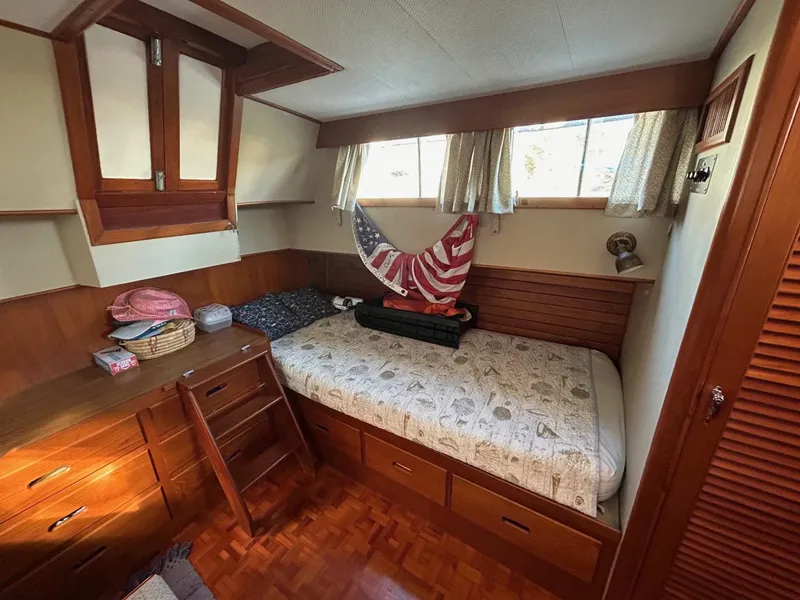 Slide: The Image of Cozy cabin interior of 1986 Grand Banks 42 Classic yacht with wooden furnishings. - 39