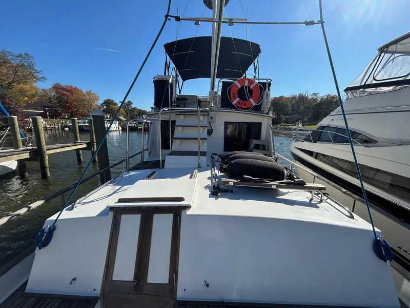 Slide: The Image of 1986 Grand Banks 42 Classic yacht docked at marina, rear view. - 7