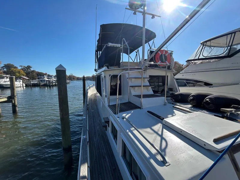 Slide: The Image of 1986 Grand Banks 42 Classic yacht docked in sunny marina. - 9