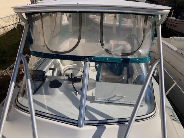 Slide: The Image of 2002 Sea Pro 235 Walk Around boat with clear windshield and sturdy frame. - 14