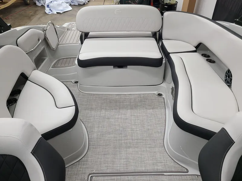 Slide: The Image of 2024 Crownline Eclipse E255 SURF boat interior with plush seating and modern design. - 10