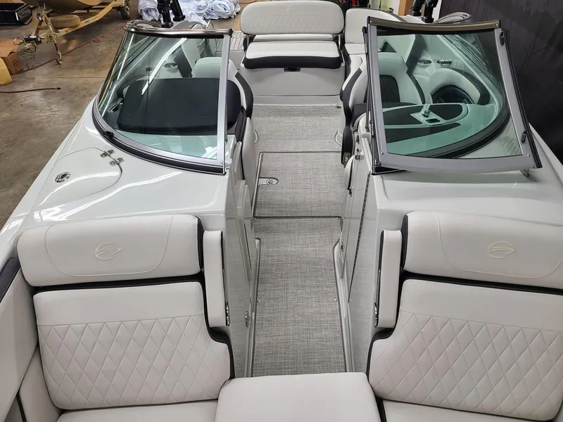 Slide: The Image of 2024 Crownline Eclipse E255 SURF boat interior with luxurious seating and modern design. - 12