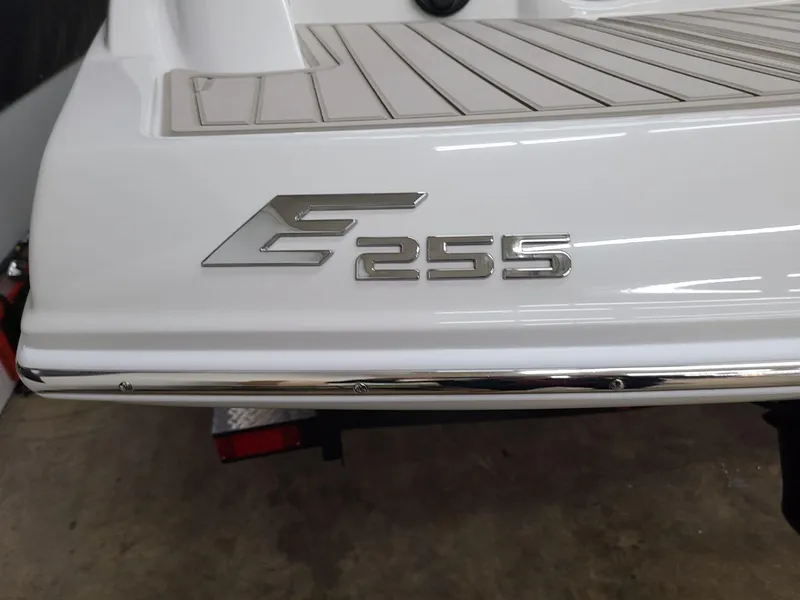 Slide: The Image of 2024 Crownline Eclipse E255 SURF boat rear view with logo detail. - 5
