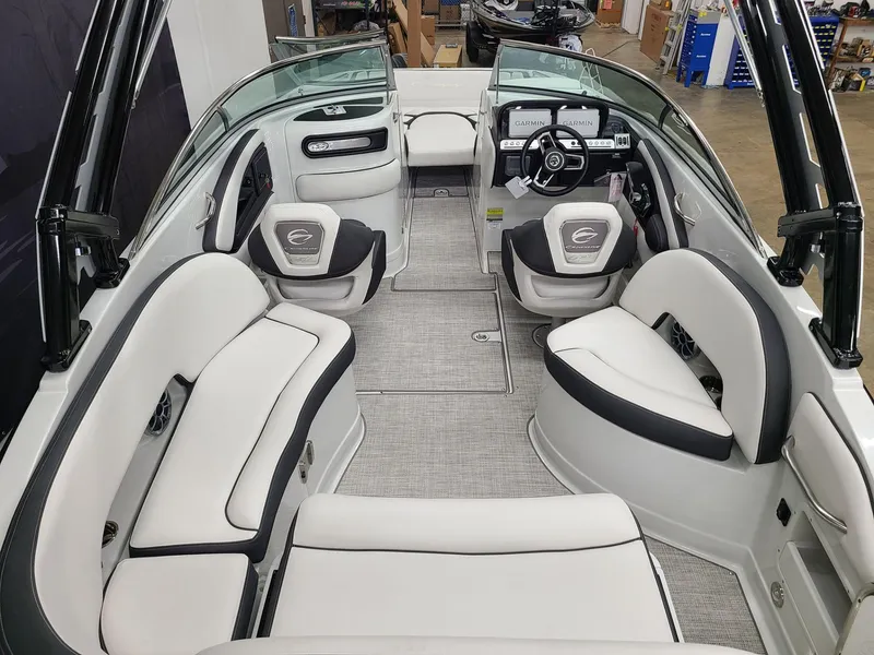 Slide: The Image of 2024 Crownline Eclipse E255 SURF boat interior with luxurious seating and modern dashboard. - 6