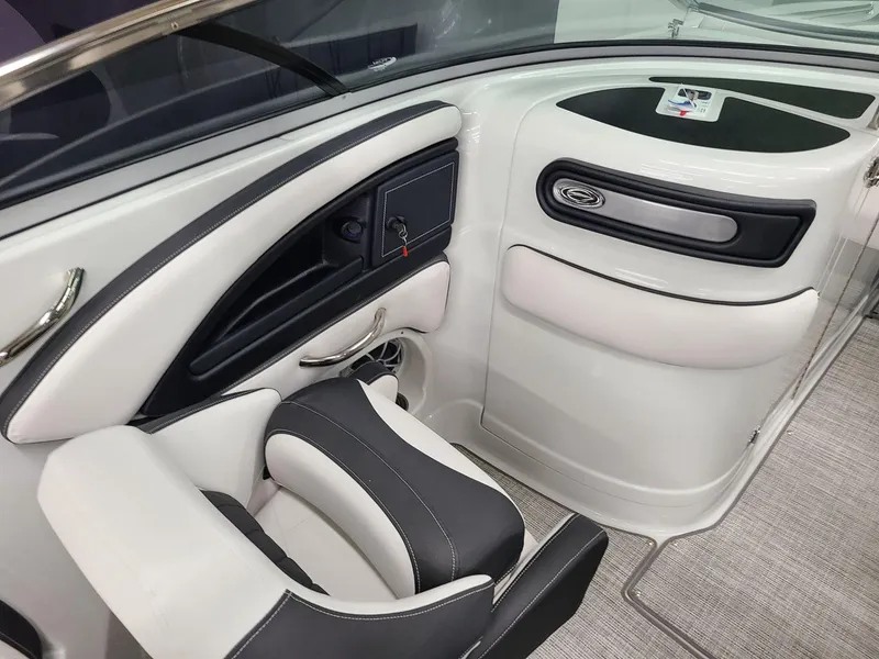 Slide: The Image of 2024 Crownline Eclipse E255 SURF boat interior with sleek seating and modern design. - 8