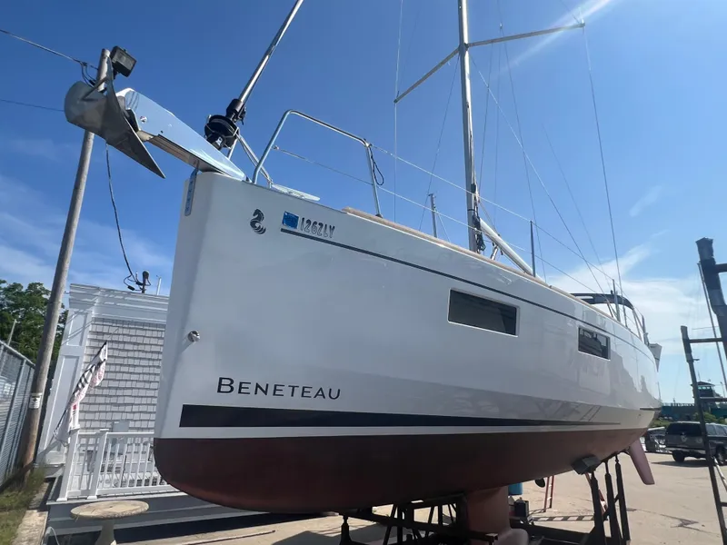 Slide: The Image of 2019 Beneteau Oceanis 35.1 sailboat on dry dock under clear blue sky. - 1