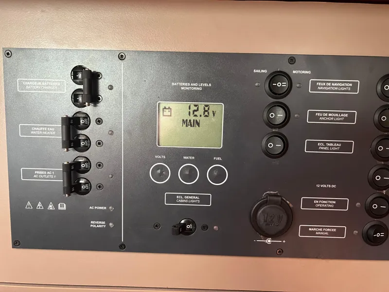 Slide: The Image of Control panel of a 2019 Beneteau Oceanis 35.1 sailboat, displaying battery voltage. - 18