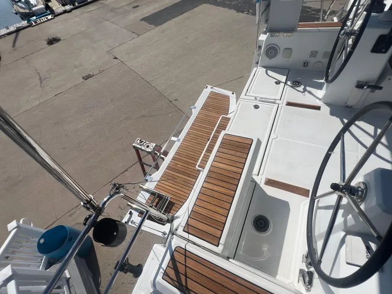 Slide: The Image of Beneteau Oceanis 35.1 sailboat deck with wooden accents, 2019 model. - 5
