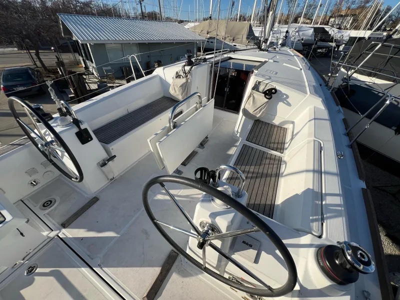 Slide: The Image of 2019 Beneteau Oceanis 35.1 sailboat cockpit with dual steering wheels and seating. - 6