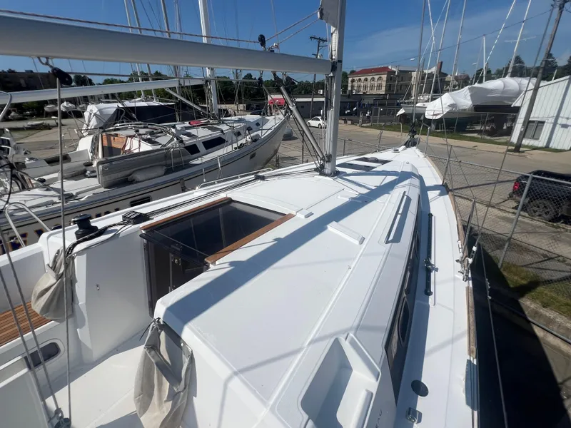 Slide: The Image of 2019 Beneteau Oceanis 35.1 sailboat docked, showcasing sleek deck design and rigging. - 8