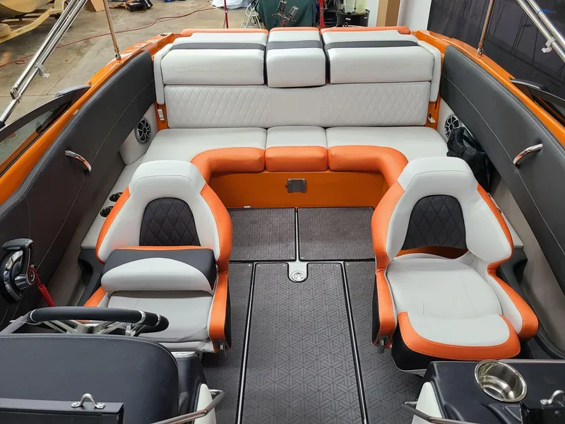 Slide: The Image of 2024 Crownline 240 SS LPX boat interior with orange and gray seating. - 11