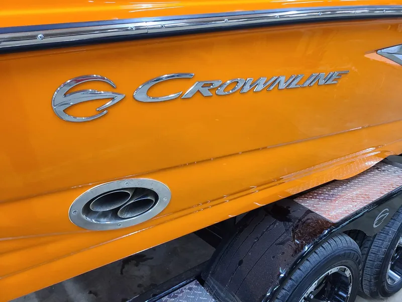 Slide: The Image of 2024 Crownline 240 SS LPX boat, vibrant orange exterior, close-up view. - 4