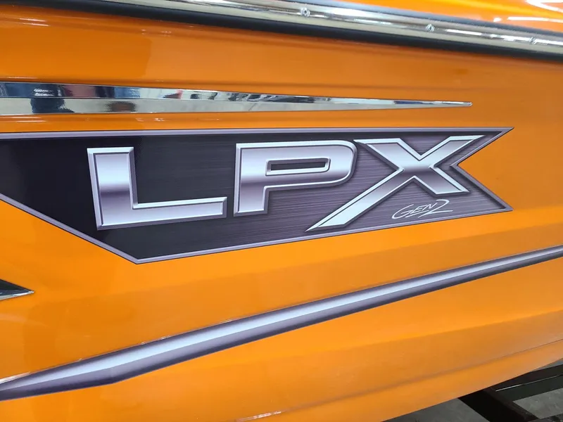 Slide: The Image of 2024 Crownline 240 SS LPX boat with vibrant orange exterior and bold LPX logo. - 5
