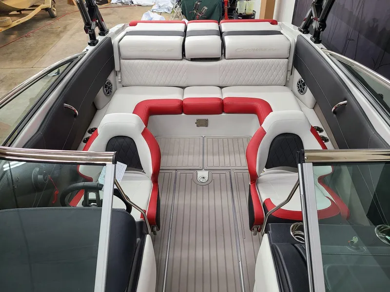Slide: The Image of 2024 Crownline 240 SS SURF boat interior with red and white seating. - 10
