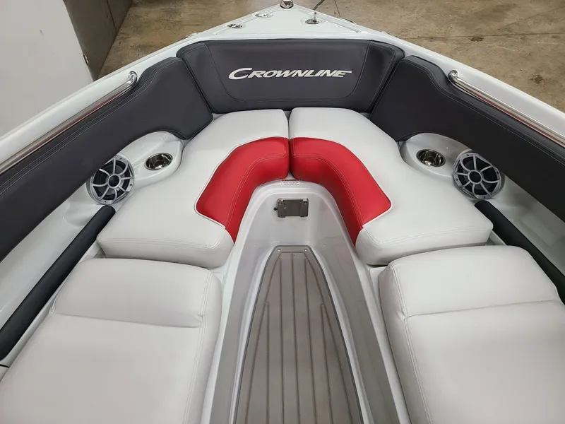Slide: The Image of 2024 Crownline 240 SS SURF boat interior with white and red seating. - 11