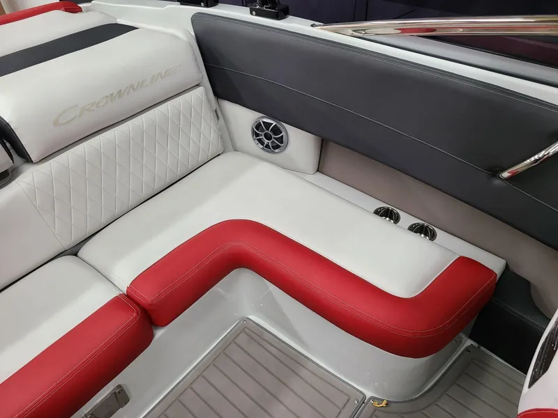 Slide: The Image of 2024 Crownline 240 SS SURF boat interior with red and white seating. - 13