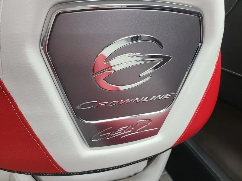 Slide: The Image of 2024 Crownline 240 SS SURF boat seat with logo and red accents. - 14