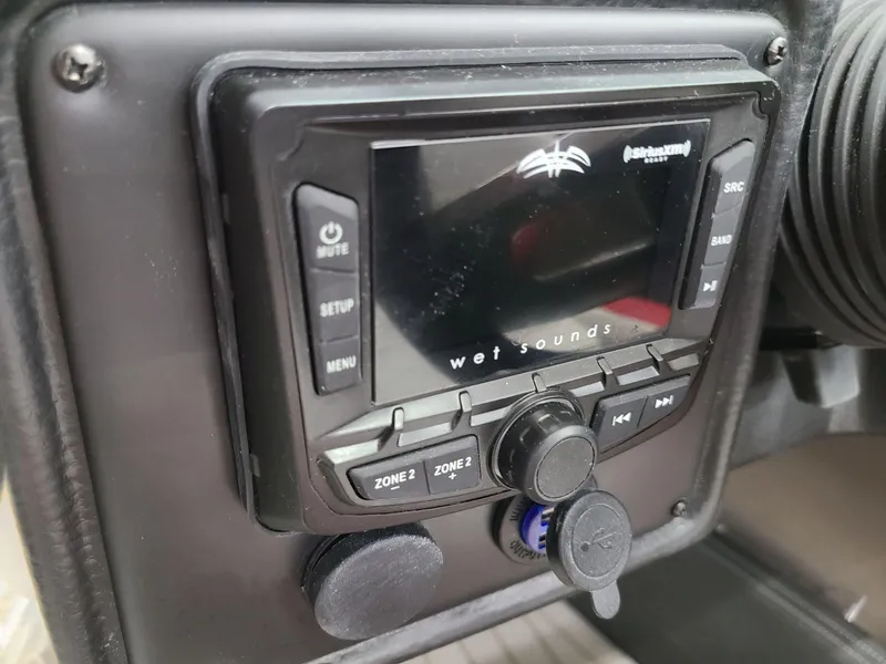 Slide: The Image of Wet Sounds audio system in 2024 Crownline 240 SS SURF boat dashboard. - 15