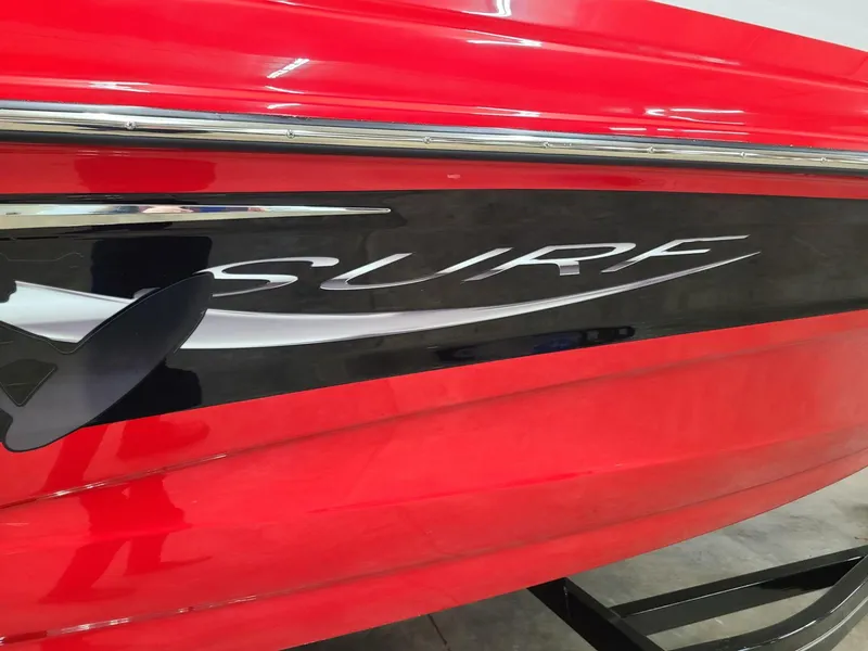 Slide: The Image of 2024 Crownline 240 SS SURF boat, red exterior with "SURF" logo detail. - 4