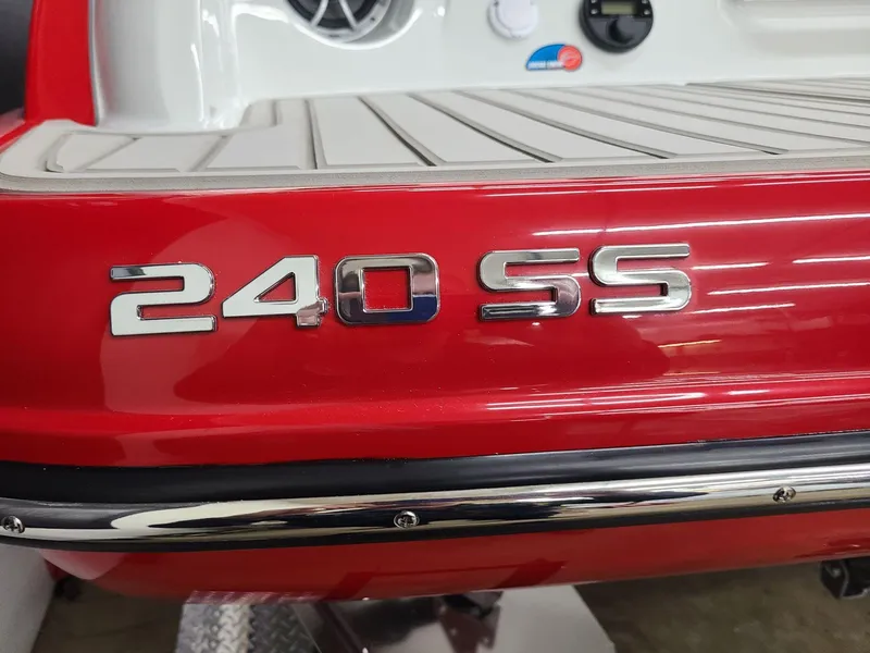 Slide: The Image of 2024 Crownline 240 SS SURF boat, red exterior with chrome lettering. - 5