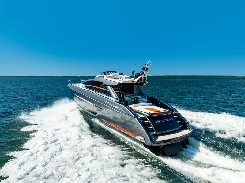 Slide: The Image of 2020 Riva 66' Ribelle luxury yacht cruising on open water. - 23