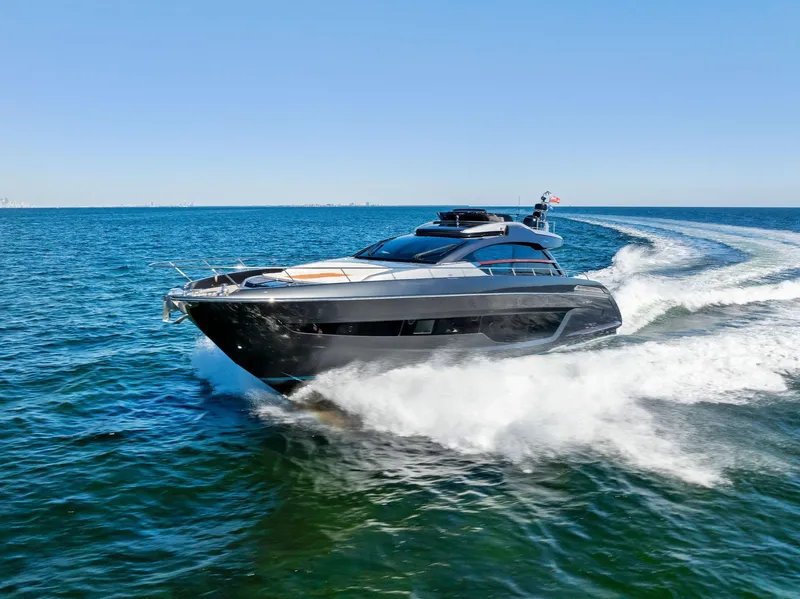 Slide: The Image of Luxury 2020 Riva 66' Ribelle yacht cruising on open sea. - 25
