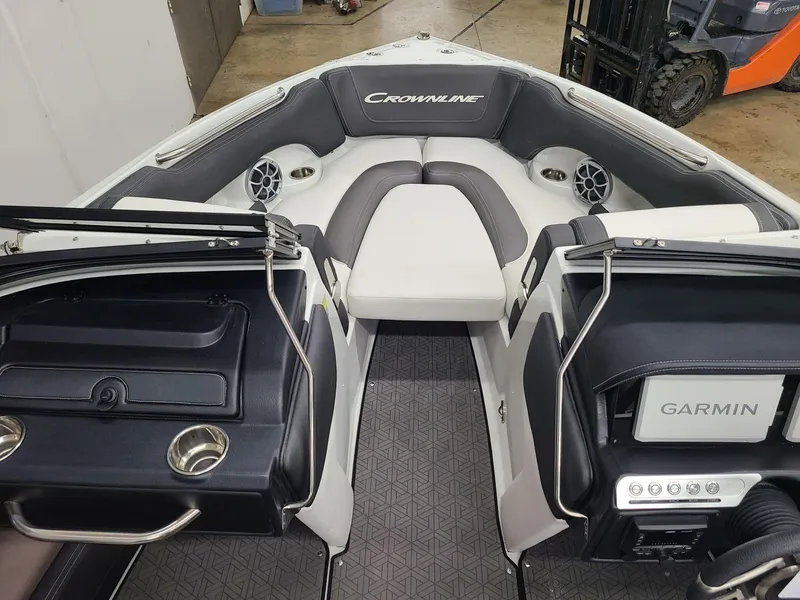Slide: The Image of 2024 Crownline 220 SS LPX boat interior with Garmin system and seating. - 10