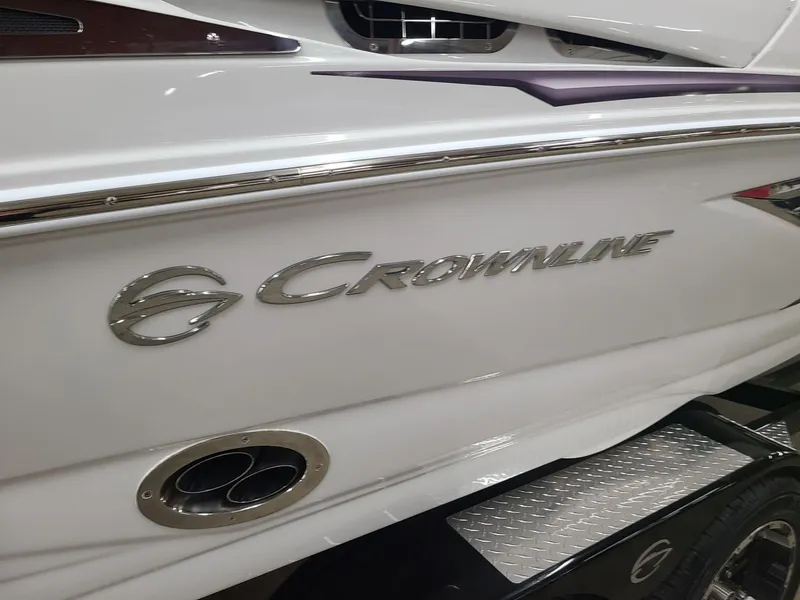 Slide: The Image of 2024 Crownline 220 SS LPX boat, sleek white exterior with logo detail. - 4