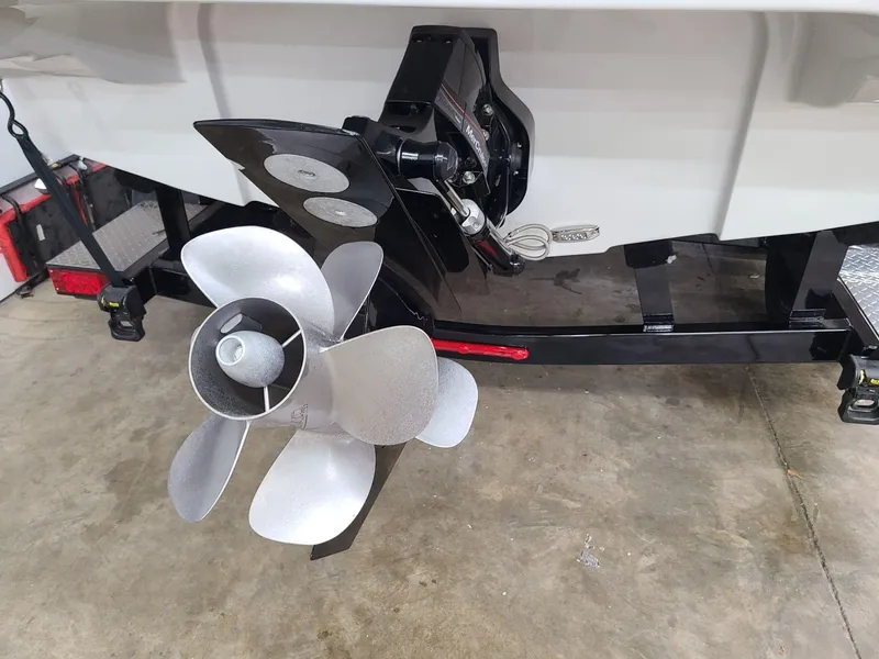 Slide: The Image of 2024 Crownline 220 SS LPX boat propeller and stern on trailer. - 9