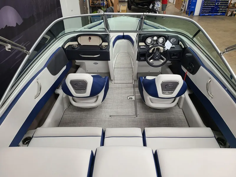Slide: The Image of 2024 Crownline 210 SS boat interior with modern dashboard and seating. - 10