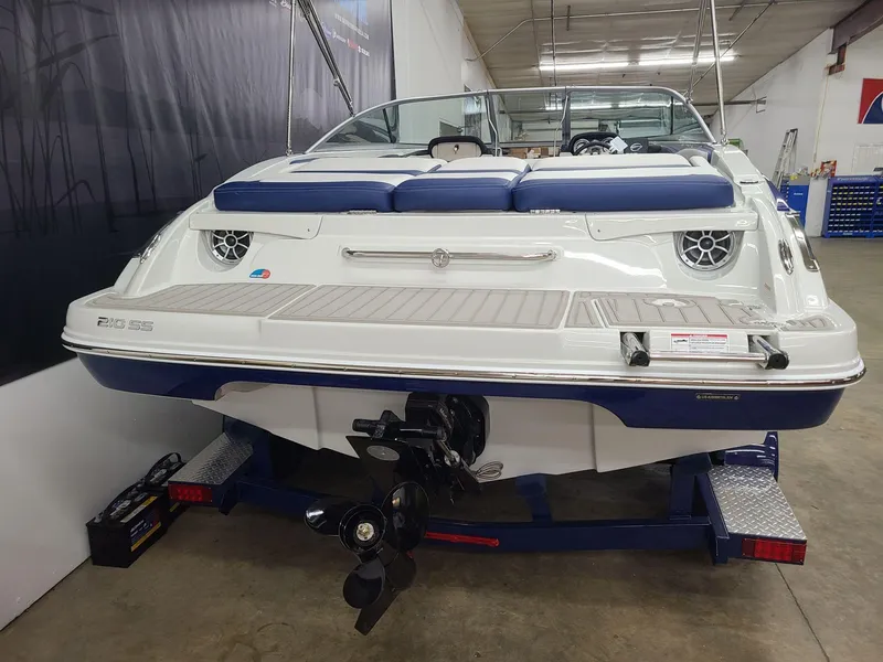 Slide: The Image of 2024 Crownline 210 SS boat on trailer in a showroom. - 3