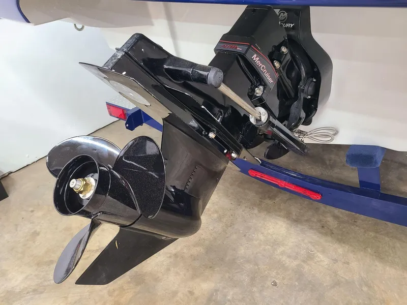 Slide: The Image of 2024 Crownline 210 SS boat with Mercury outboard motor and propeller. - 8