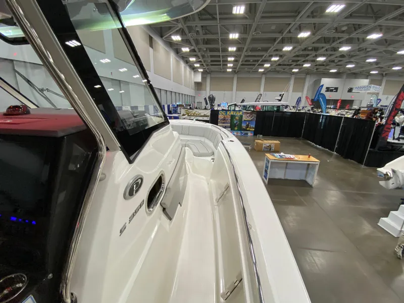 Slide: The Image of 2024 Pursuit S 358 boat displayed at an indoor exhibition. - 12