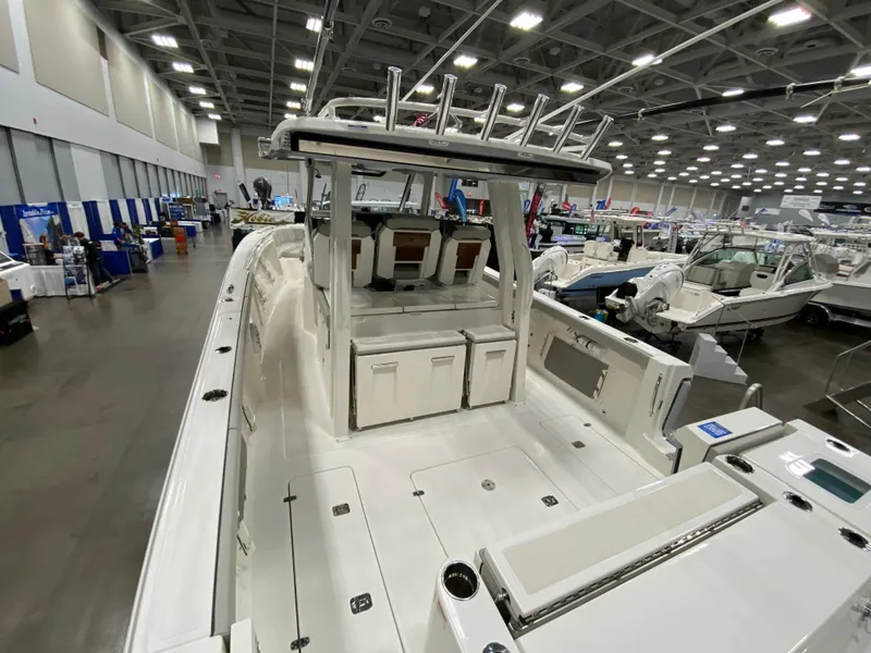 Slide: The Image of 2024 Pursuit S 358 boat displayed at an indoor exhibition. - 6