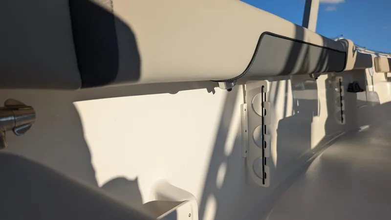 Slide: The Image of Interior view of 2025 Key West 239 FS boat, featuring sleek seating and storage compartments. - 11