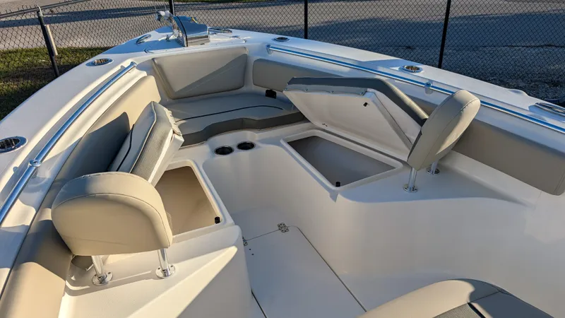 Slide: The Image of 2025 Key West 239 FS boat interior with cushioned seating and storage compartments. - 17