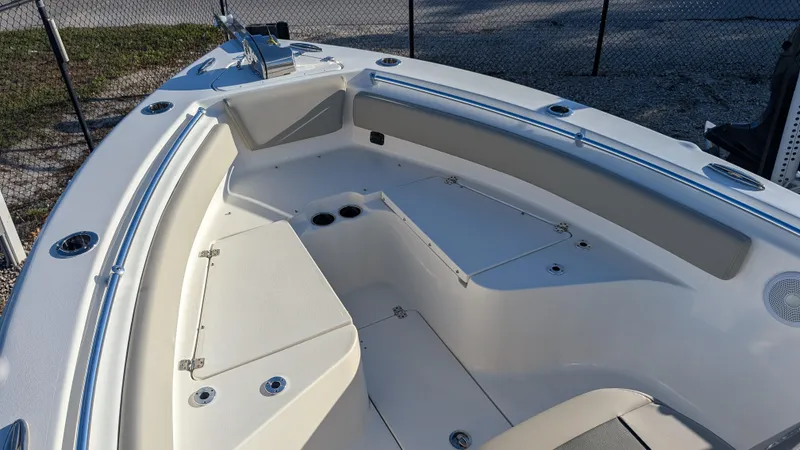 Slide: The Image of 2025 Key West 239 FS boat interior with spacious seating and storage compartments. - 18