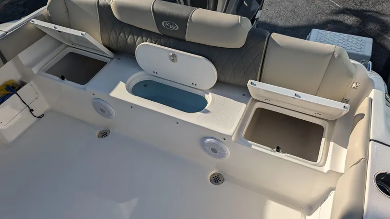 Slide: The Image of 2025 Key West 239 FS boat interior with storage compartments and seating. - 8