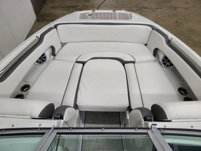 Slide: The Image of 2024 Crownline Eclipse E220 XS boat interior with white seating and cup holders. - 10