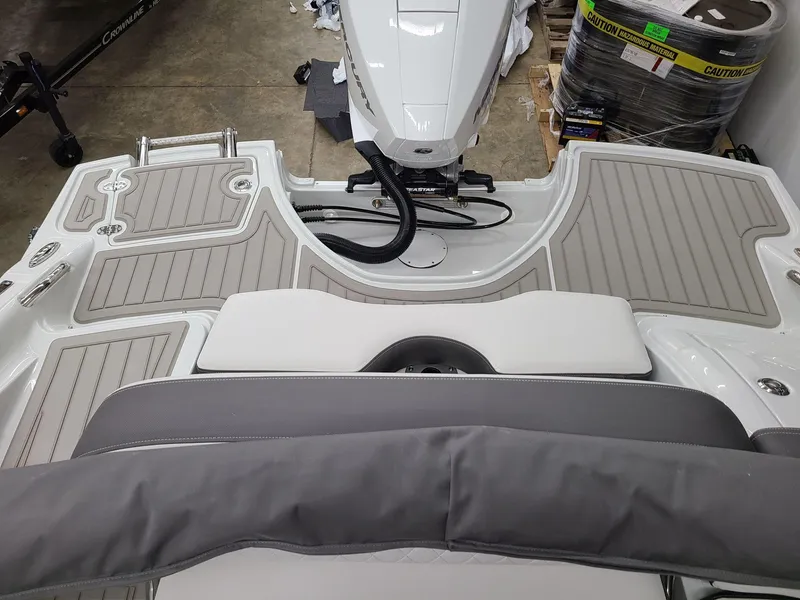 Slide: The Image of 2024 Crownline Eclipse E220 XS boat interior with sleek gray seating and deck design. - 7