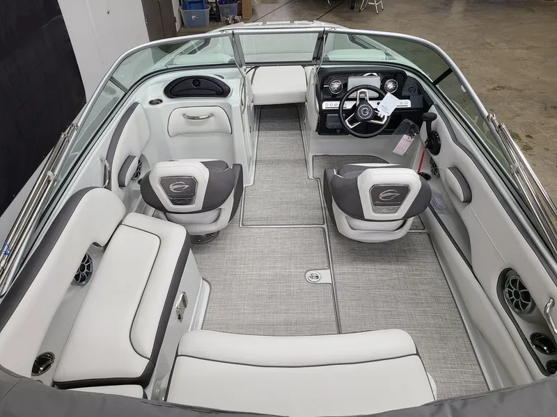 Slide: The Image of 2024 Crownline Eclipse E220 XS boat interior with modern seating and dashboard. - 8