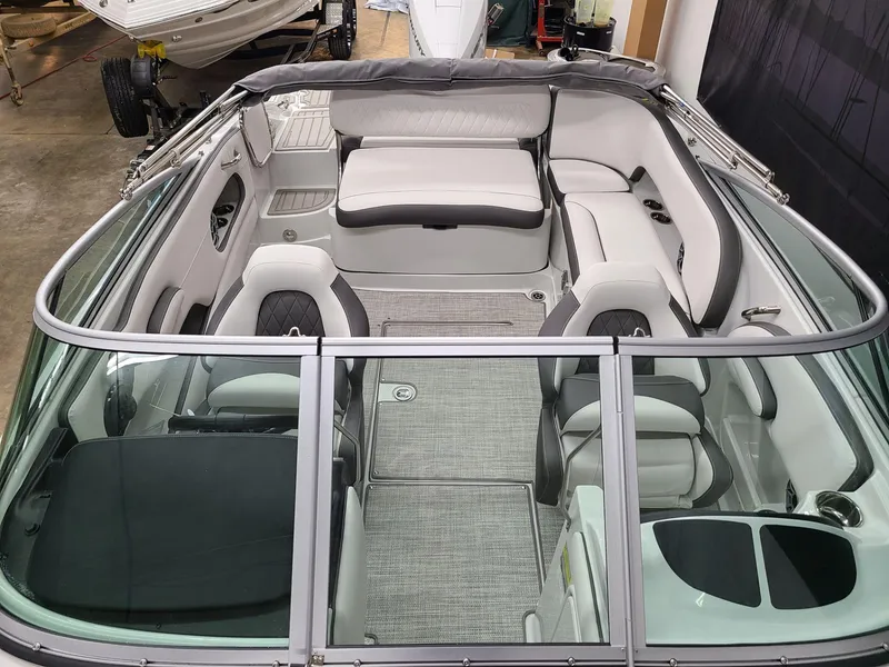 Slide: The Image of 2024 Crownline Eclipse E220 XS boat interior with spacious seating and modern design. - 9